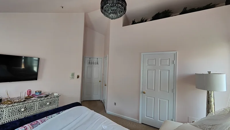 Bedroom walls evenly repainted in a soft neutral color