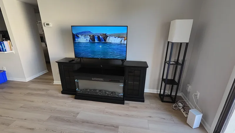 Completed black media console and matching tower shelf