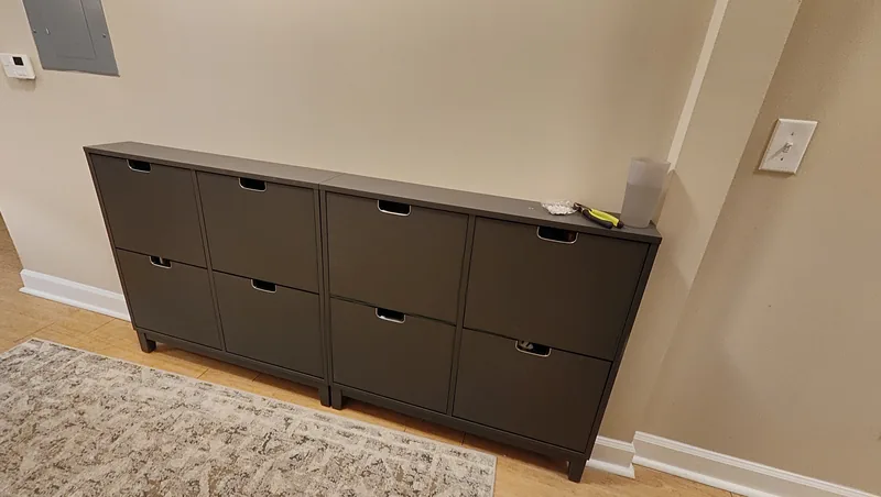 Completed low-profile charcoal storage cabinet with aligned doors and drawers